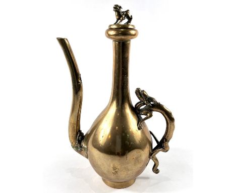 A late 19th/early 19th Chinese polished bronze ewer with dragon handle and dog to lid of finial, height 25.5cm.&nbsp;&nbsp;De