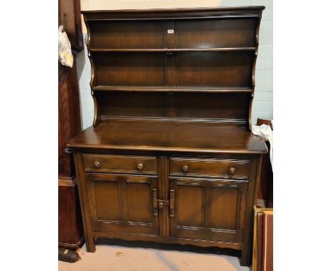 An Ercol modern high back dresser with plate rack over double cupboards, height 161cm, length 120cm 