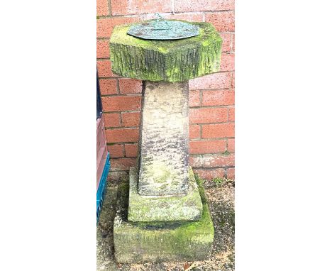 A stone sundial.&nbsp; This comes in 4 separate pieces