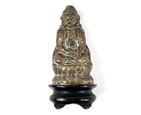 A Circa 1900 Chinese gilt bronze&nbsp; figure on wooden base, figure seated crossed legs with hands in lap, height 5.5cm.&nbs