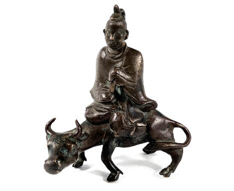 A 19th century Chinese scholars scroll weight depicting man sat on ox length 7cm height 8cm.&nbsp;&nbsp;Appears in good condi