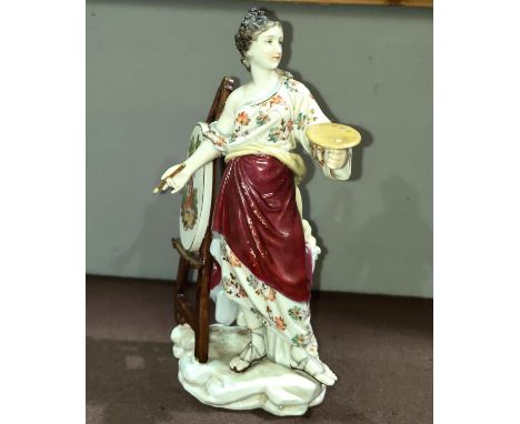 A porcelain figure of a female painting at an easel in the Meissen style with crossed swords to base, height 21cm 
