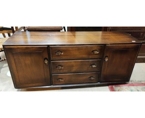 An Ercol sideboard of double cupboard and 3 drawers in dark finish length 155 x d.46 x ht 68cm 