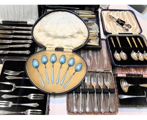 A cased set of silver gilt and blue enamel coffee spoons; a cased set of 6 tea knives stamped "Sterling" and other cased cutl