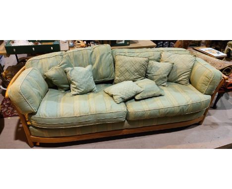 A modern Ercol light elm 3 seater settee in green stripe fabric 