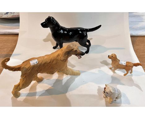 A Beswick bisque Afghan hound, length 22cm; a Beswick black Labrador, length 22cm; a Beswick Golden Labrador, length 10cm; a 