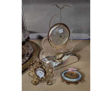 A dressing table clock in ormolu and blue enamel; a gilt watch stand and watch;&nbsp; 2 novelty clocks 