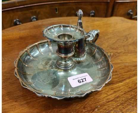 A 19th century silver plated chamber candle stick with incised crest&nbsp;&nbsp; 