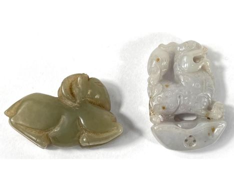 Two Chinese jade coloured hard stone carved animals, one a ram lying down length 5.5, the other a dog of Fo height 5cm.&nbsp;