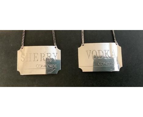 A boxed set of hallmarked silver Concorde bottle tags for vodka and sherry 