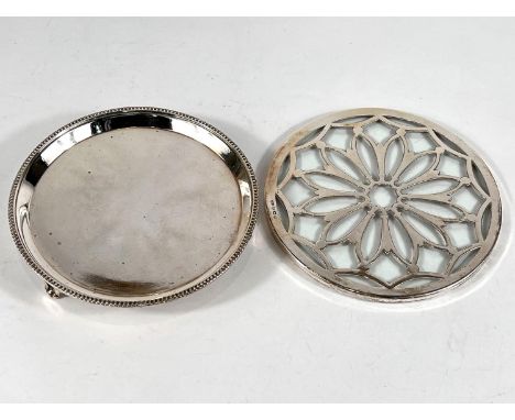 A circular beaded waiter with raised gadrooned border and three bracket feet, Birmingham 1927, 4.5ozs, diameter 15cm; a circu