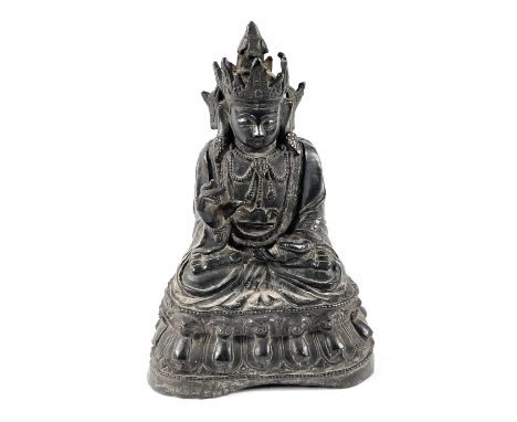 A Chinese Ming period bronze of Guanyin seated with crossed legs, height 23cm.&nbsp;&nbsp;Finger missing from hand, left hand
