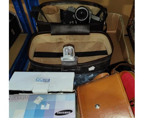 An SLR Camera with lenses in case + other cameras and accessories. 