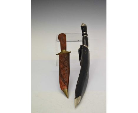Indian Kukri knife with lion heads motif, two smaller knives, 42cm long, together with a modern dagger in decorative sheath, 
