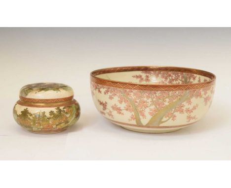 Japanese Satsuma bowl, of footed form, the interior painted and gilded with buildings and figures beneath blossoming trees be