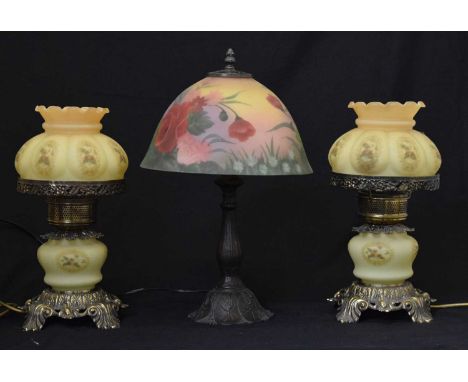 Pair of electric gilt metal and yellow glass table lamps, each with floral decorated panels, 37cm high, together with a moder