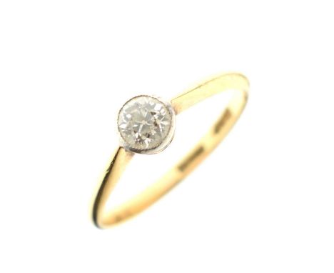 Single stone diamond ring, the old brilliant cut rub-over set in white metal, the yellow metal shank stamped '18ct Plat', siz