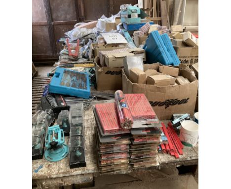 Large qty of screws, nails, tools, drill bits, safety hats all on work bench which is included. 