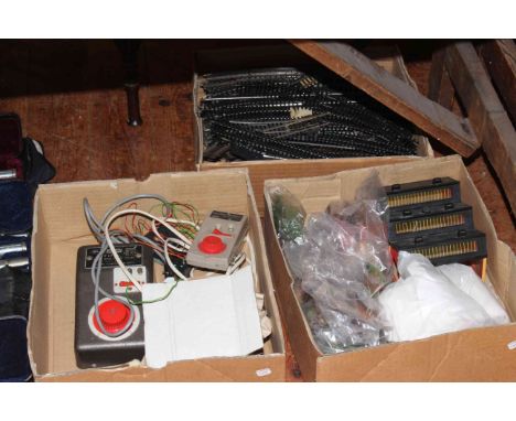 Three boxes of model railway accessories and track.
