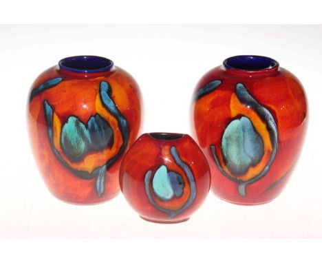 Three Poole vases.