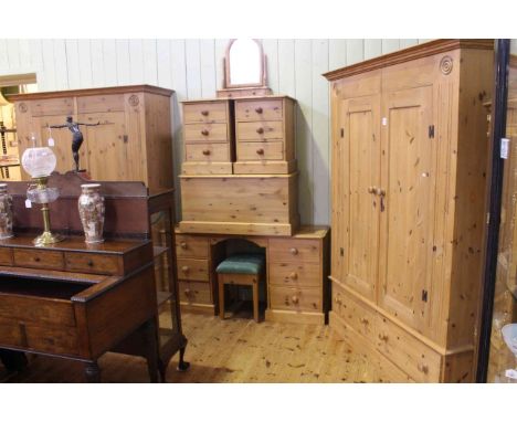 Pine nine piece bedroom suite comprising two combination wardrobes having double doors with two drawers below, six drawer ped