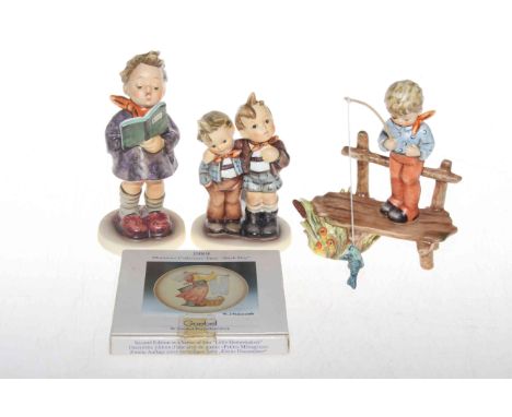 Three Hummel figures and a boxed 1989 plate (4).