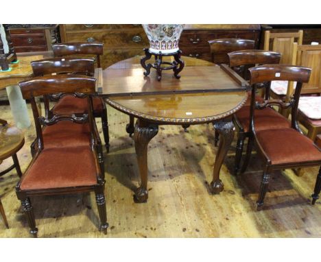 Oval mahogany Chippendale style dining table and leaf together with a set of six Victorian mahogany bar back dining chairs.