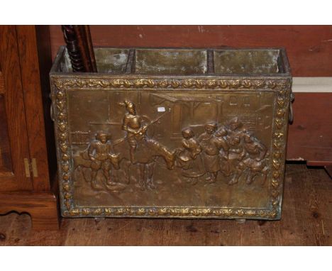 Embossed brass three compartment stick stand with lion mask ring handles, 67cm.