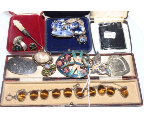 Collection of jewellery including tigers eye bracelet, enamel and silver brooches etc and a parasol.
