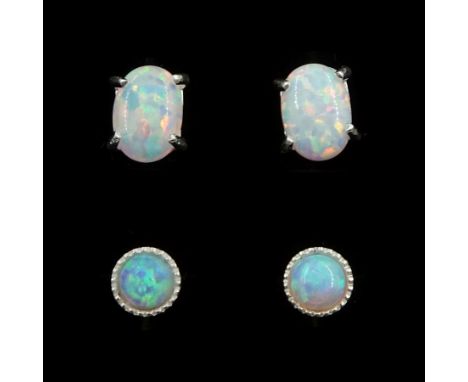 Two pairs of silver opal stud earringsCondition Report:Max length = 6.7mm, good condition