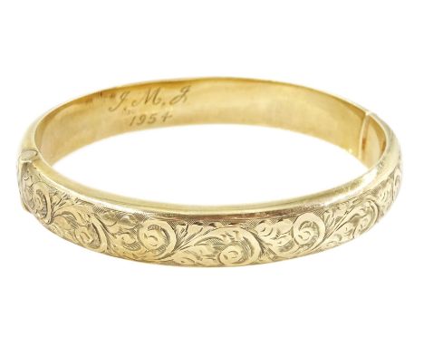 9ct gold hinged bangle, with engraved foliate decoration, Chester 1953Condition Report:Approx 13.75gm, inner circumference = 