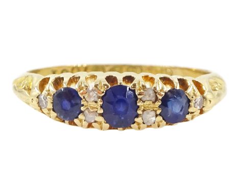 Edwardian 18ct gold three stone oval cut sapphire ring, with diamond accents set between, Chester 1909Condition Report:Approx