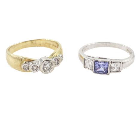 White gold blue and white paste stone set ring and a yellow gold graduating five stone cubic zirconia ring, both hallmarked 9