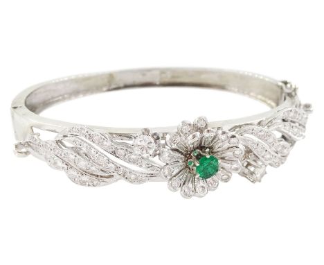 14ct white gold round brilliant cut diamond and emerald floral hinged bangle, stampedCondition Report:Approx 23.85gm, also te