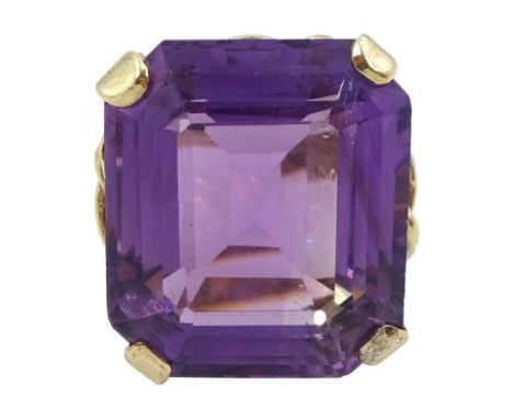 9ct gold single stone octagonal cut amethyst ring, with fancy rope twist design gallery, London 1972Condition Report:Approx 9