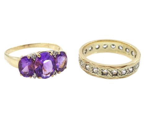 Gold three stone oval cut amethyst and four stone diamond chip ring and a white spinel full eternity ring, both 9ctCondition 