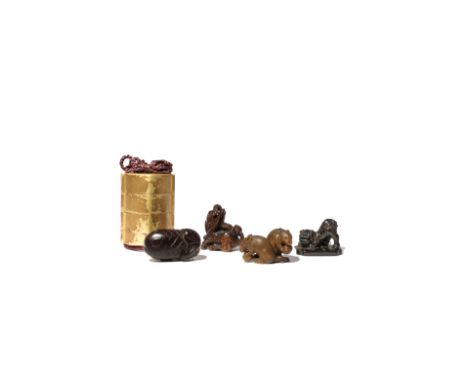 THREE JAPANESE WOOD NETSUKE 18TH-20TH CENTURIES One carved as a small shishi crouching on its front legs, on a rectangular ba