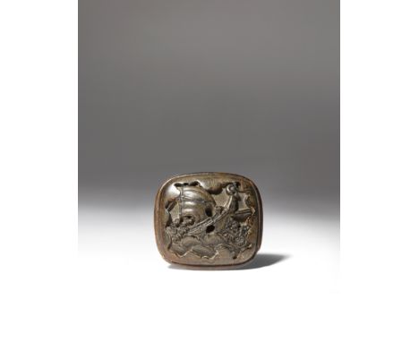 AN UNUSUAL JAPANESE HORN MANJU NETSUKE MEIJI 1868-1912 Possibly moulded, the rectangular body decorated to one side with an a