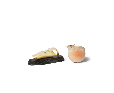 λ TWO JAPANESE IVORY MODELS OF FRUITS, OKIMONO MEIJI 1868-1912 One depicting an apple with its skin partially peeled, the sur