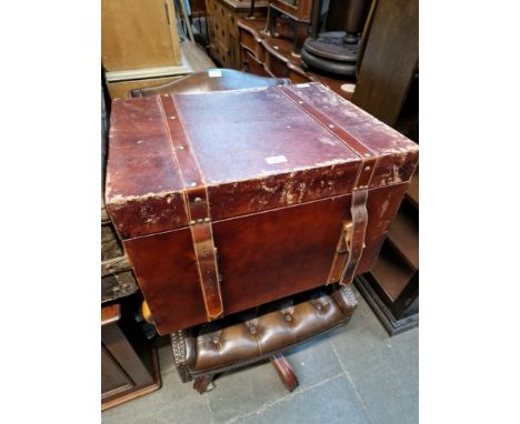 A leather bound trunk. 