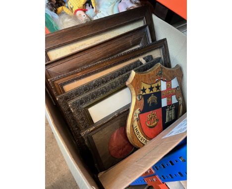 A collection of early 20th century oak frames together with an oak shield shaped panel with painted crest from Harrogate Ladi