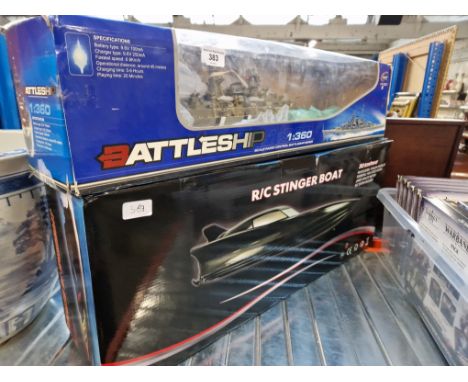 A boxed  R/C stinger boat &amp; a Boxed R/C HT-3827 Battleship 1/360 Scale. 
