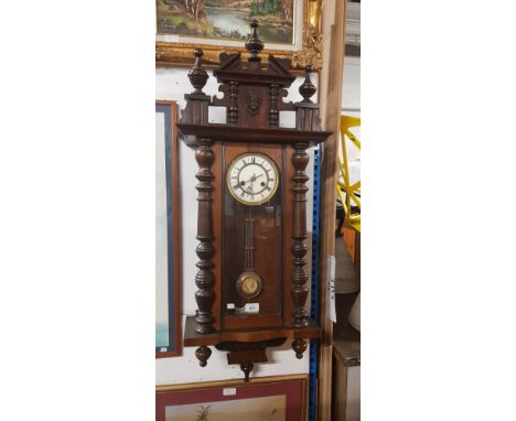 A Vienna wall clock, the enamelled dial marked with crossed arrows for The Hamburg American Clock Company. 