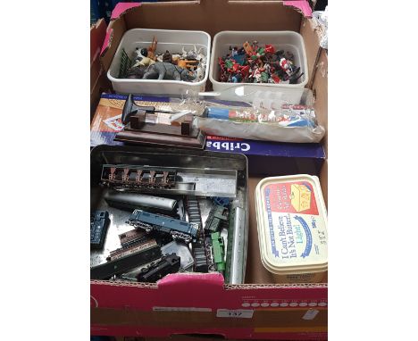 A box of toys including plastic figures, animals, model railway engines, cribbage set, and a box of marbles 