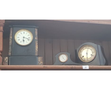 A slate mantle clock with key, a Smiths mantle clock with key and pendulum, and a small mantle clock 