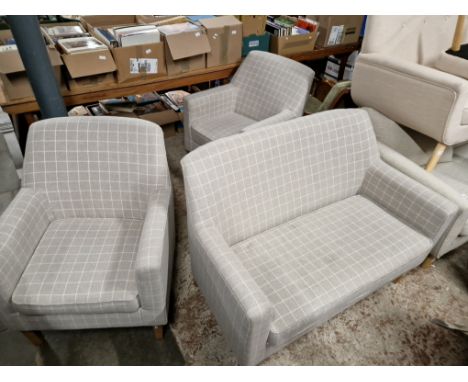 A modern grey two seater sofa and matching armchairs. 