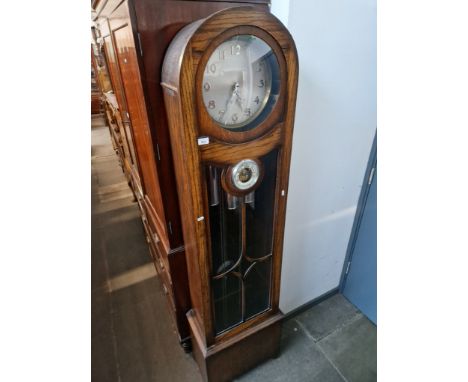 A 1920s oak cased grandmother clock barometer, complete with weights and pendulum. 