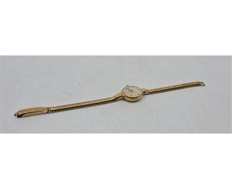 An Omega 18ct. gold ladies' wrist watch, cal.244, manual movement, having signed circular Arabic numeral dial, Omega crown, 1