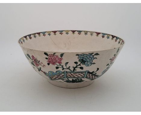 An 18th century English Delftware bowl, painted in colours, Gautier collection label to base, height 9.3cm x diameter 22.2cm.