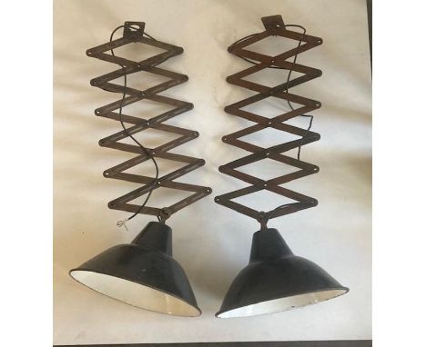 A pair of industrial enamel lamps 